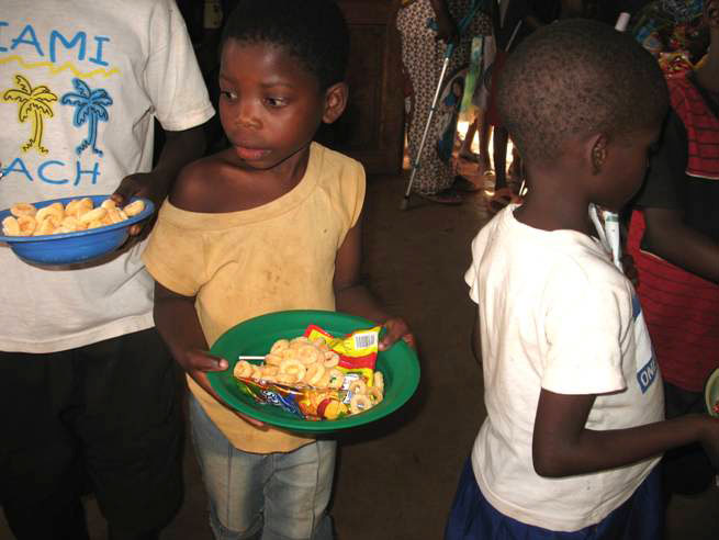 Maoni Orphanage kids in line for food