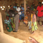 Praying for the sick at Kamanga village