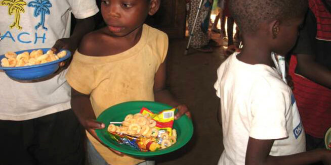 Maoni Orphanage kids in line for food