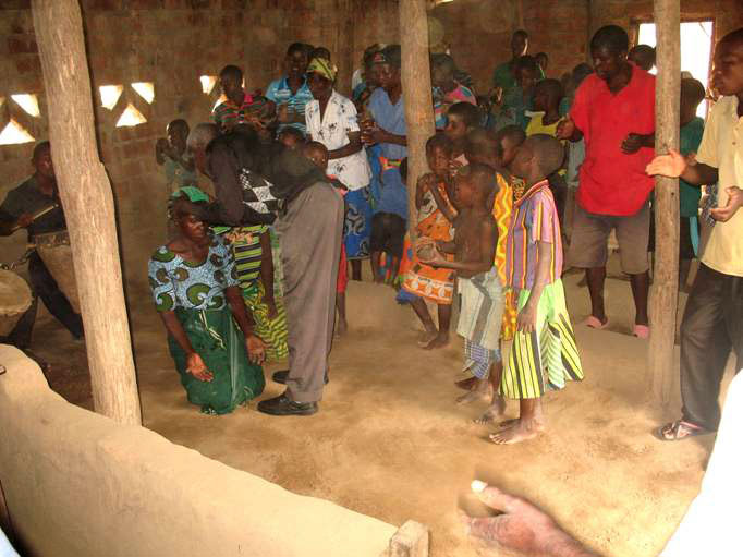 Praying for the sick at Kamanga village